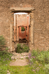 Old red brick/ stone walls of abandoned houses, background/ texture.