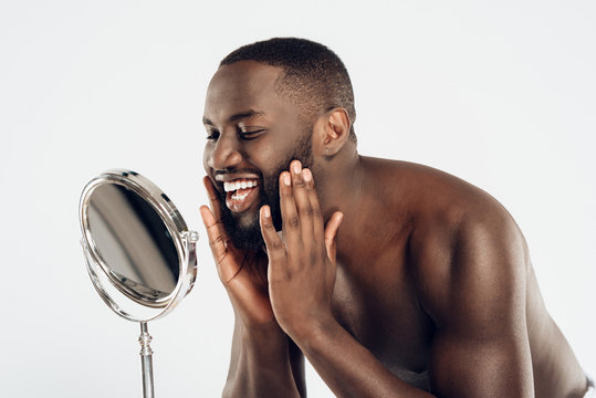 African American Man Uses Moisturizing Lotion