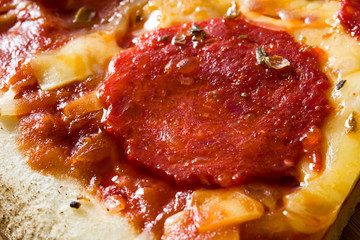 Hot italian pepperoni pizza slice on wooden table. 