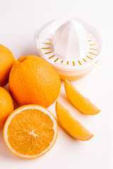 oranges and juice on a white background