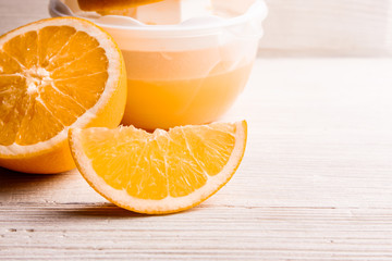 oranges and juice on a white background