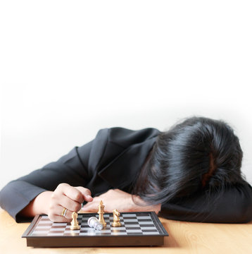 Business Woman Face Down On The Table Losing In Game With Chess Board For Business Challenge Metaphor And Lose Compitition Concept On The White Background With Copy Space