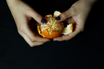 mandarin in hands