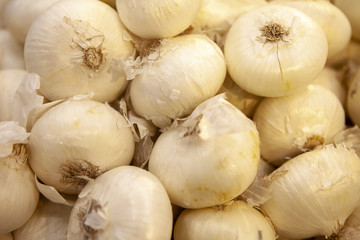 Blonde onions in the storefront