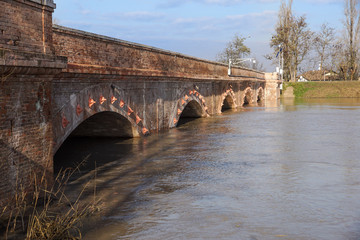 Fototapeta premium bridge with full river . River is full . Bridge to cross the river that is flooding.