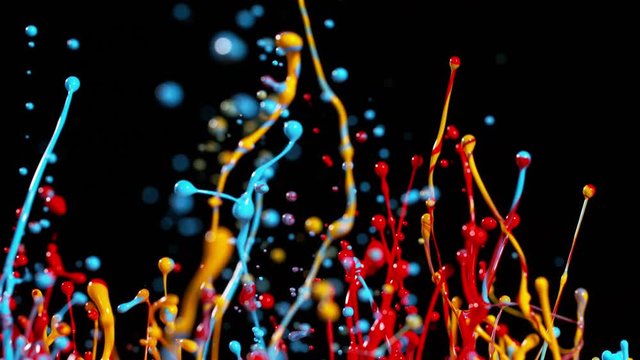 Colorful splashing paint in super slow motion. Shot with high speed cinema camera, 1000fps