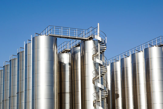 Silver wine Silos with blue sky in background
