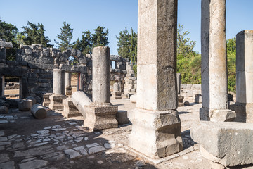 Remains  of columns in the inner hall of the ruins of the Big Sinagogue of the Talmudic Period in Bar'am National Park in Israel.