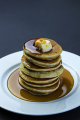 freshly prepared punkakes with maple syrup for breakfast