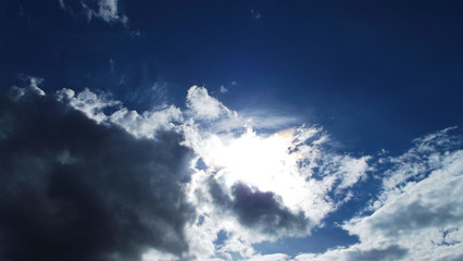 Naklejka na ściany i meble White clouds on a blue sky background.Natural background.