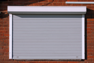 Closed light grey security shutters