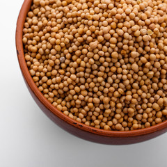 fragrant grains of mustard on a white background