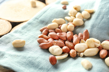 Tasty peanuts on cloth, closeup