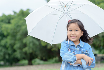 asian girl smile and holding white umbrella