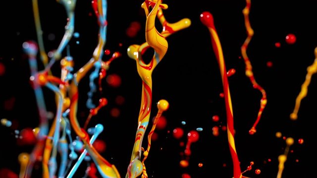 Colorful splashing paint in super slow motion. Shot with high speed cinema camera, 1000fps