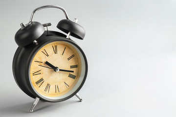 Alarm clock on light background. Time management concept