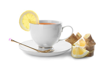 Cup of delicious tea with ginger and lemon on white background
