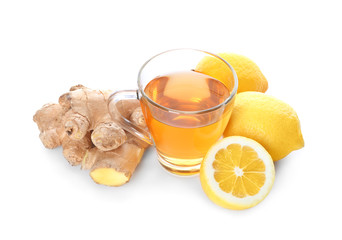 Cup of delicious tea with ginger and lemon on white background