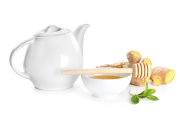 Delicious tea with honey and ginger on white background
