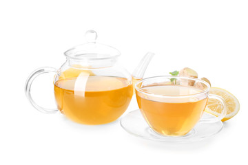 Delicious tea with lemon and ginger on white background