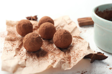 Tasty chocolate truffles on white table, closeup