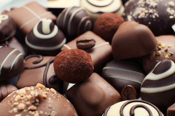 Different tasty chocolate candies, closeup