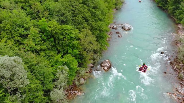 Aerial shot of people in boats whitewater rafting trip on Tara river in Montenegro, two boats