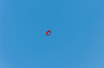  Balloon shape heart on blue sky,far shoot,soft focus.