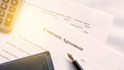 contract agreement document for sign with pen