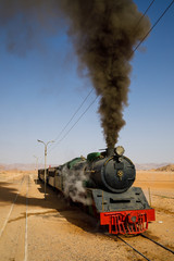 Fototapeta premium Steam locomotive in the desert of Wadi Rum in Jordan