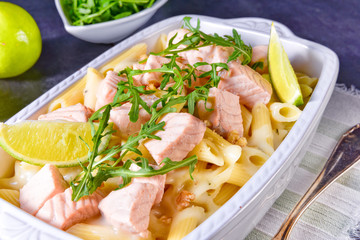Salmon with penne noodle and arugula