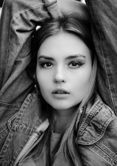 Fashion portrait beautiful girl. denim jeans wear over. beauty woman. make-up. Black and white photography