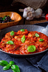 Rustic mini meatballs  Baked  in tomato sauce with basil