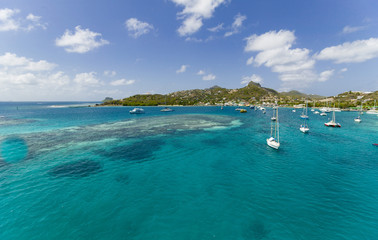 Fototapeta na wymiar anchoring sailbooats in the shallow waters of Union Island,St.Vincent and Grenadines,West Indies