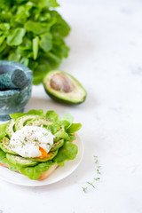Egg-poached with ciabatta, avocado and baby lettuce leaves
