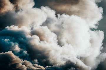 Dramatic dark clouds or smoke from the fire, background