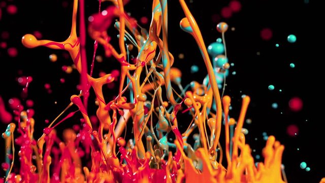 Colorful splashing paint in super slow motion. Shot with high speed cinema camera, 1000fps