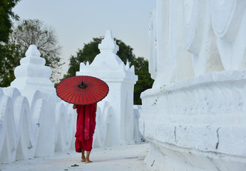 A Buddhist novice monk at white temple