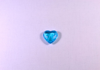 Sapphire heart in the background.