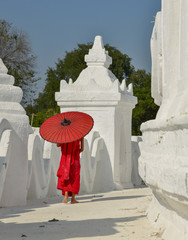A Buddhist novice monk at white temple