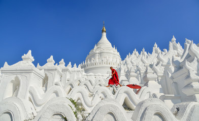 A Buddhist novice monk at white temple
