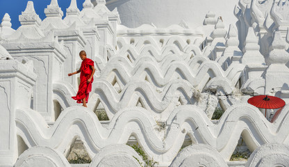 A Buddhist novice monk at white temple