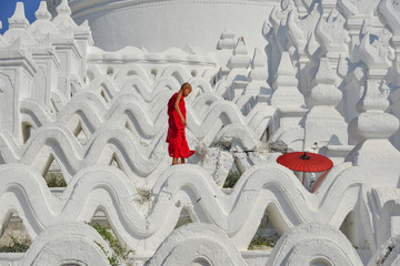 A Buddhist novice monk at white temple