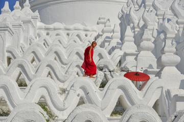 A Buddhist novice monk at white temple