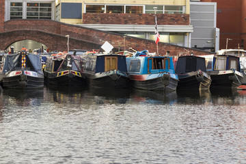 Fototapeta na wymiar Row of canal boats moored up in Birmingham UK