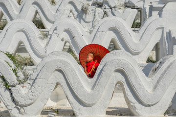 A Buddhist novice monk at white temple