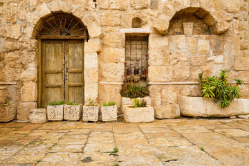 Fototapeta na wymiar Stone Entrances at the St. John the Baptist Roman Catholic Church in Madaba, Jordan