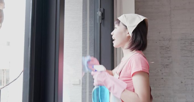 woman housewife wipe windows