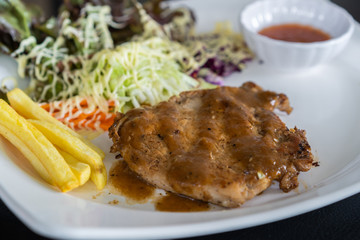pork steak with sauce in plate