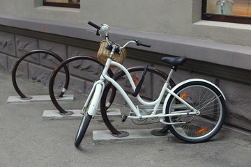 Fototapeta na wymiar A vintage bicycle stands on the bike park ..